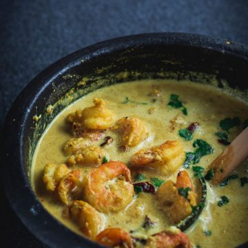 Goan prawn curry in black earthenware pot