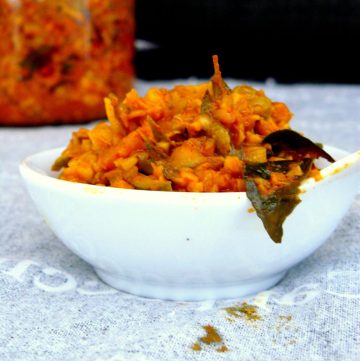 Indian mango pickle in small white bowl