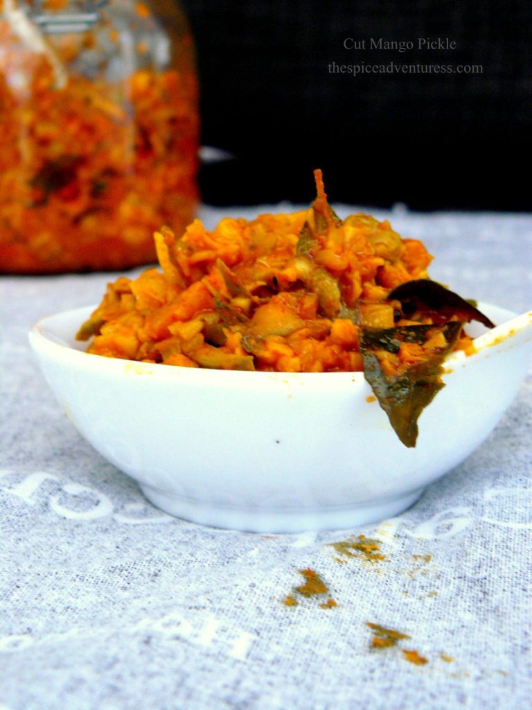 Indian mango pickle in small white bowl