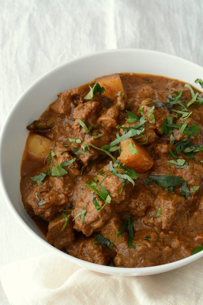 Indian beef curry in white bowl