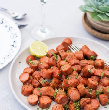 Cajun spiced sausages served in grey plate