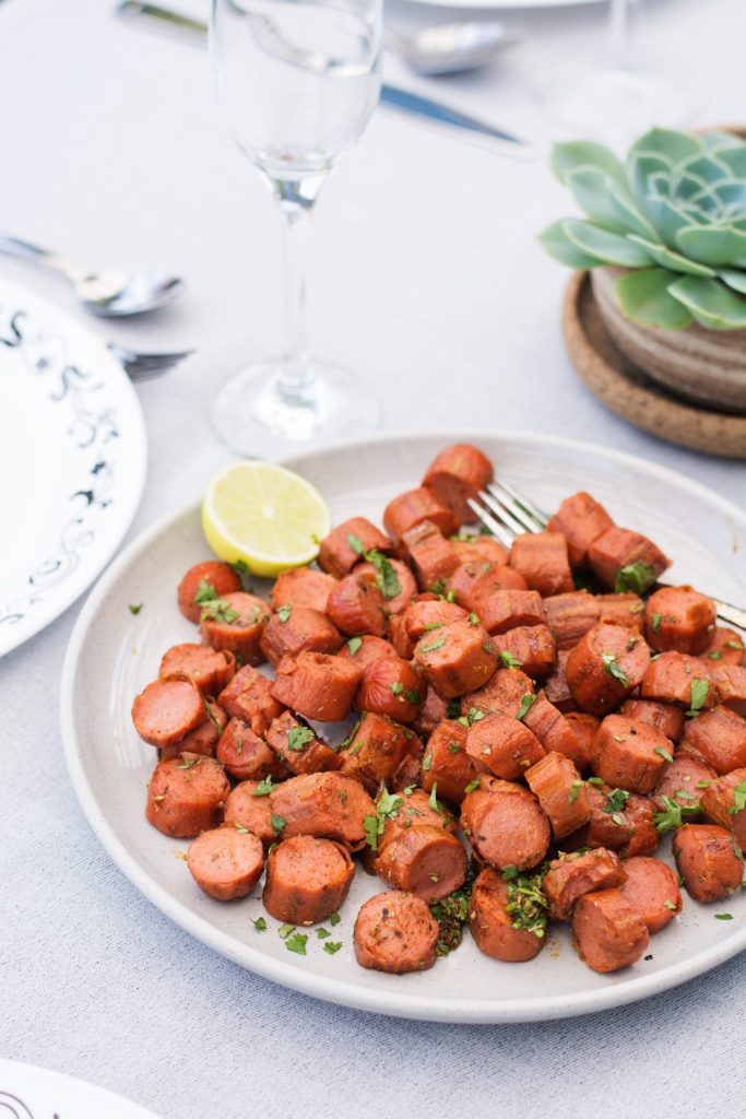 Cajun spiced sausages served in grey plate