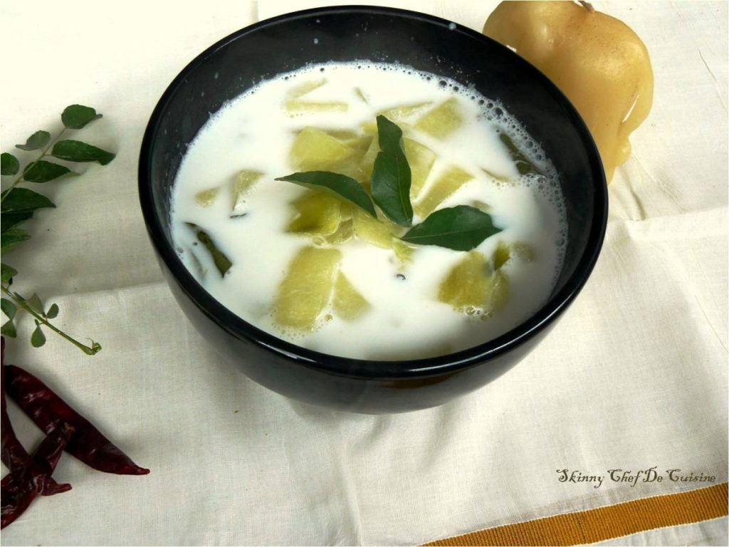 Cucumber coconut milk curry garnished with curry leaves