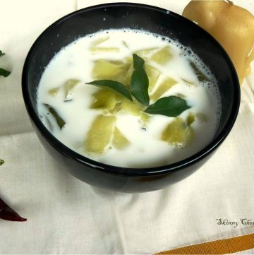 Cucumber coconut milk curry garnished with curry leaves