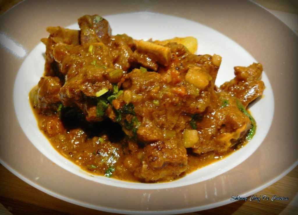 Lamb stew with vegetables served on white plate