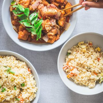 fish chilli and fried rice in white bowls