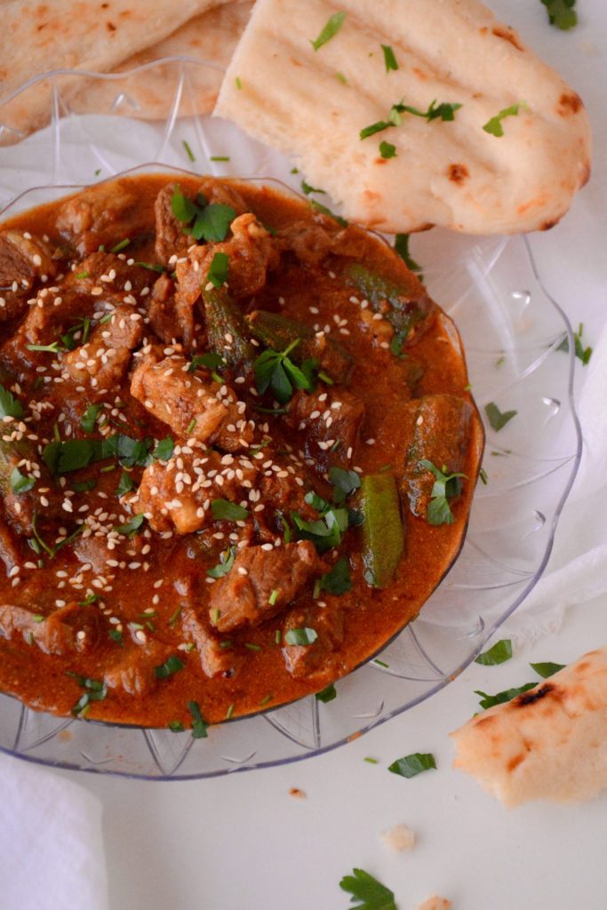 Lamb and okra curry with flatbread on the side