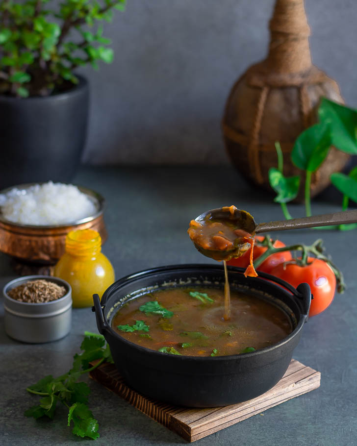 rasam in black bowl