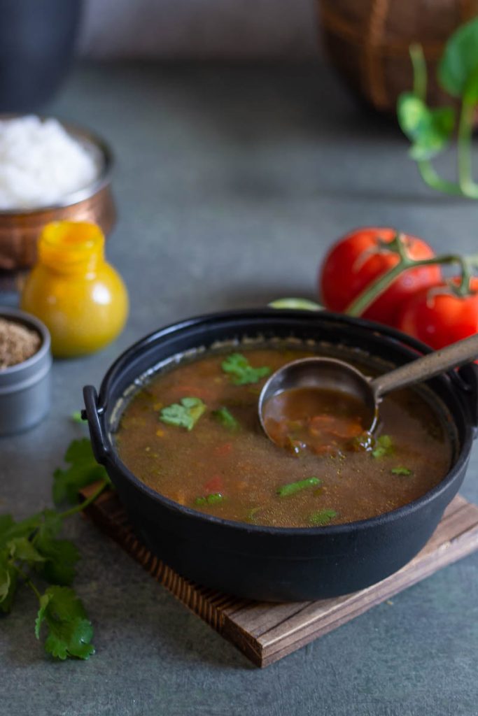 rasam in black bowl