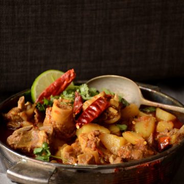 Mutton curry in grey bowl