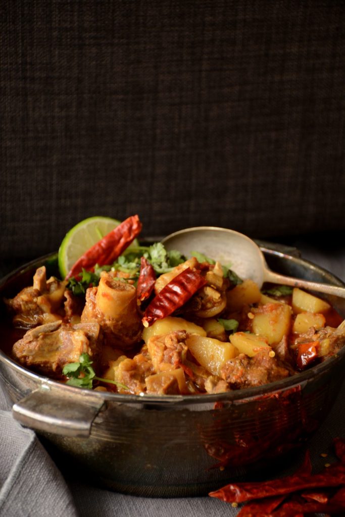 Mutton curry in grey bowl