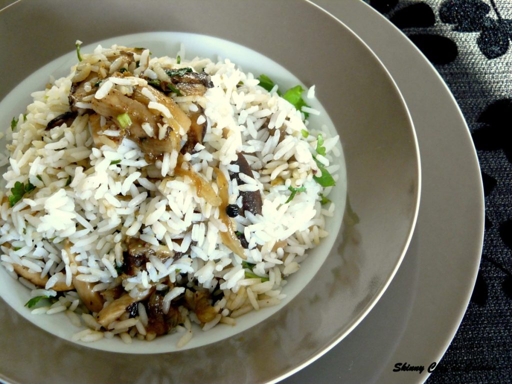 Rice dish with mushrooms served in grey plate