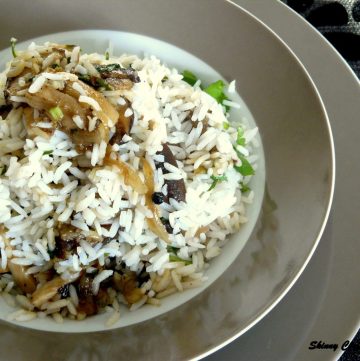 Rice dish with mushrooms served in grey plate