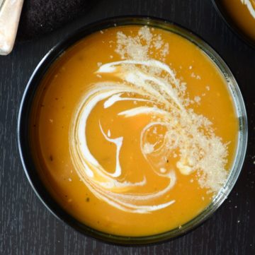 Butternut squash soup in black bowl