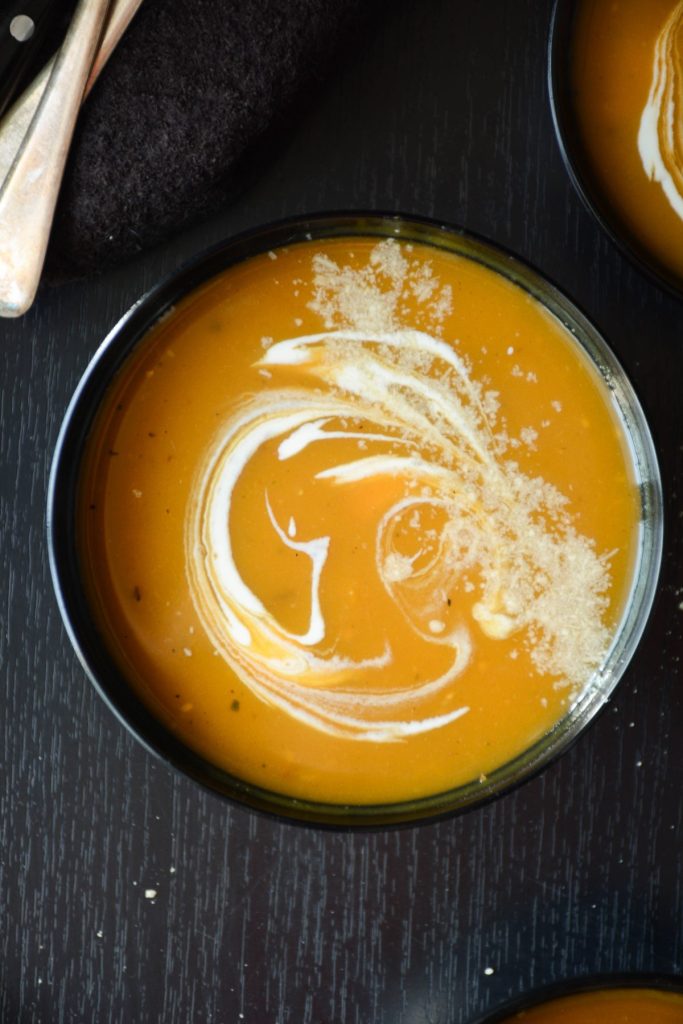 Butternut squash soup in black bowl