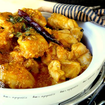 Indian chicken curry in white bowl