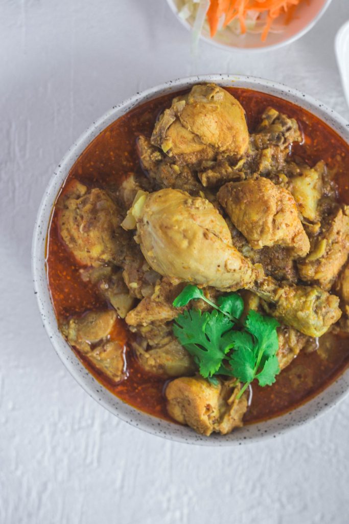 Indian chicken curry in grey bowl