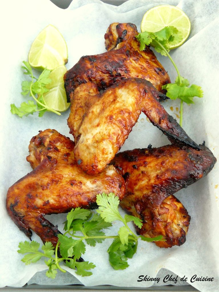 Grilled chicken wings garnished with coriander leaves