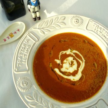 Roasted capsicum soup in white bowl