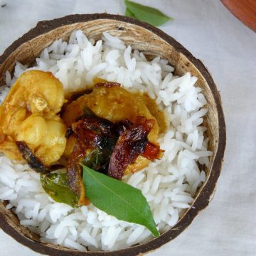 Rice and prawn curry served in coconut shell