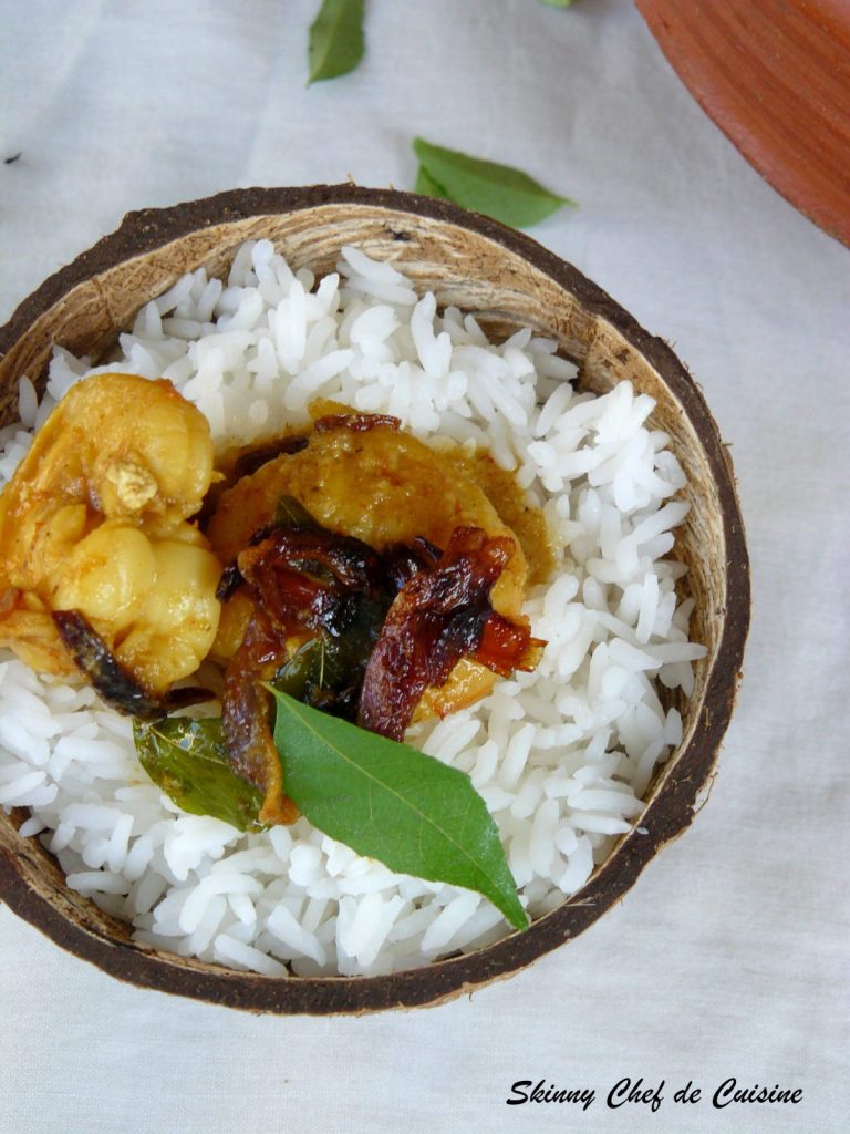 Rice and prawn curry served in coconut shell