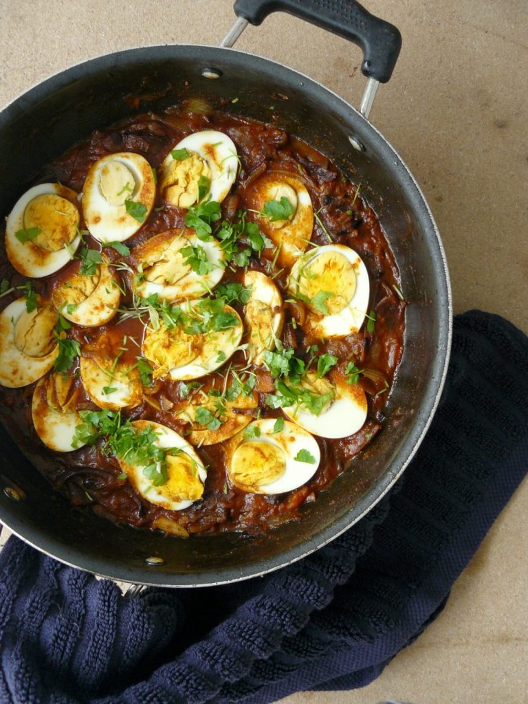 Indian egg curry in a black pan