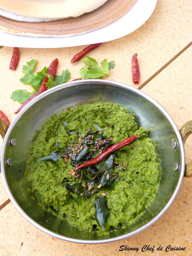 Coriander chutney garnished with spices and chillies