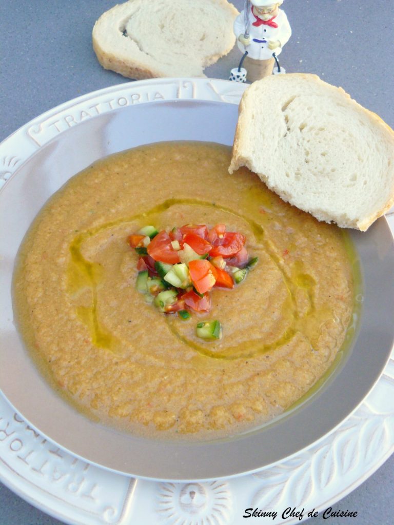 Vegetable soup in grey bowl with bread on the side