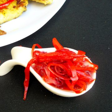 Chilli jam on a small white spoon