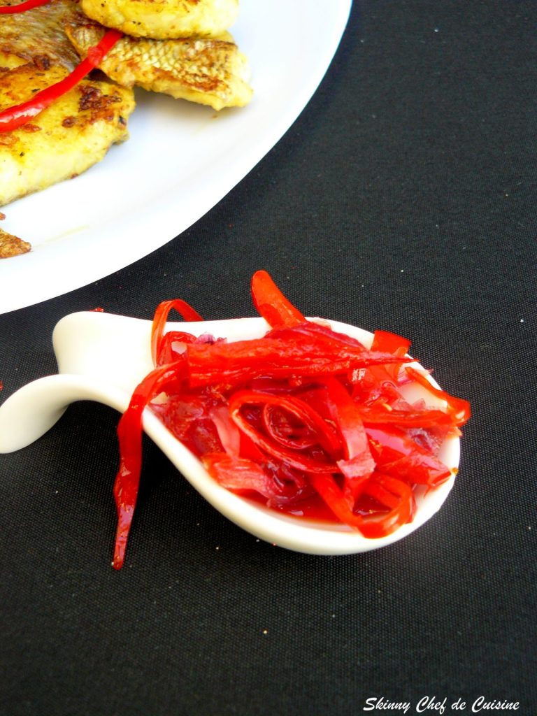 Chilli jam on a small white spoon