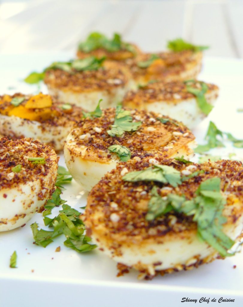 Fried boiled eggs with spices and herbs