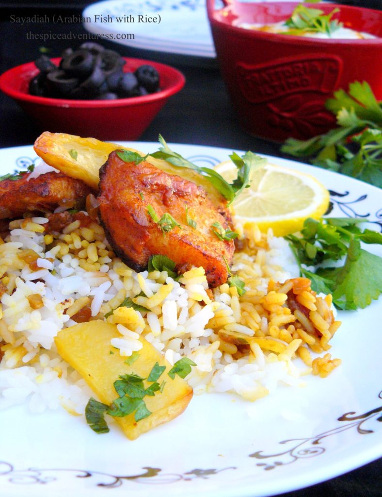 Fish pieces with rice, potatoes and lemon