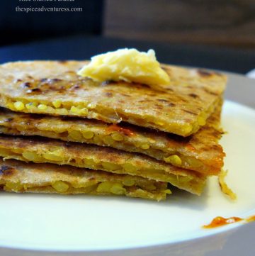 A stack of flatbreads stuffed with spiced rice