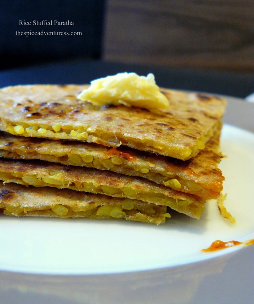 A stack of flatbreads stuffed with spiced rice