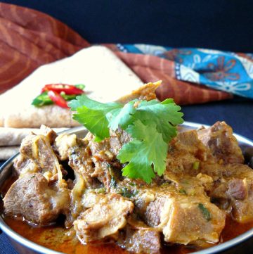 Indian lamb curry in copper bowl