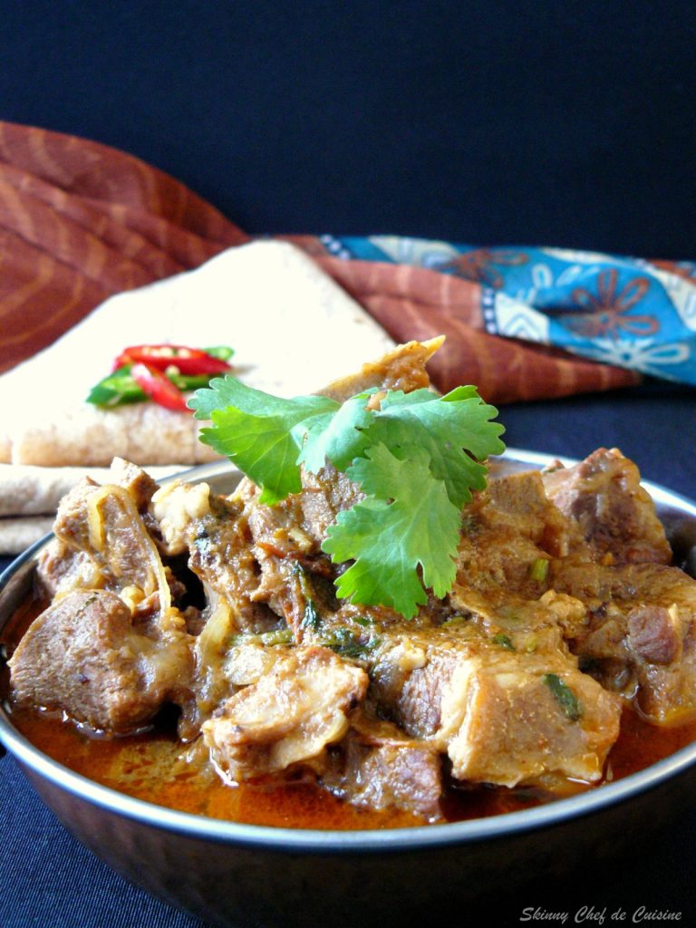 Indian lamb curry in copper bowl
