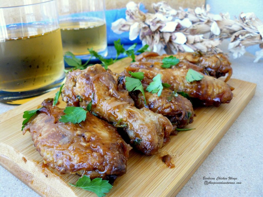 Grilled chicken wings and two glasses of beer
