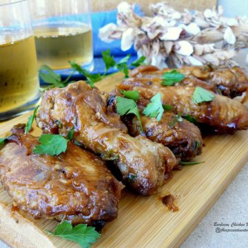 Grilled chicken wings and two glasses of beer