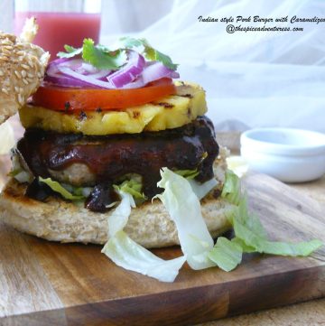 Open view of pork burger with pineapple