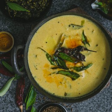 Indian taro root yoghurt curry in cast iron pot