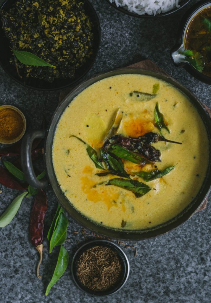 Indian taro root yoghurt curry in cast iron pot