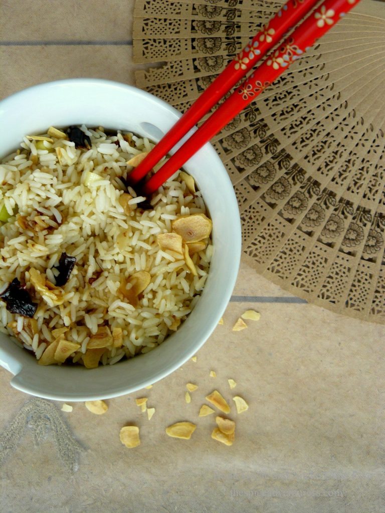 Rice with garlic and chilli in white bowl