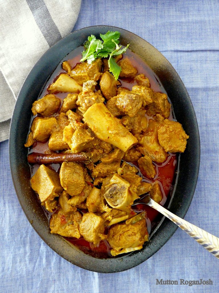 Indian goat curry in oval shaped bowl