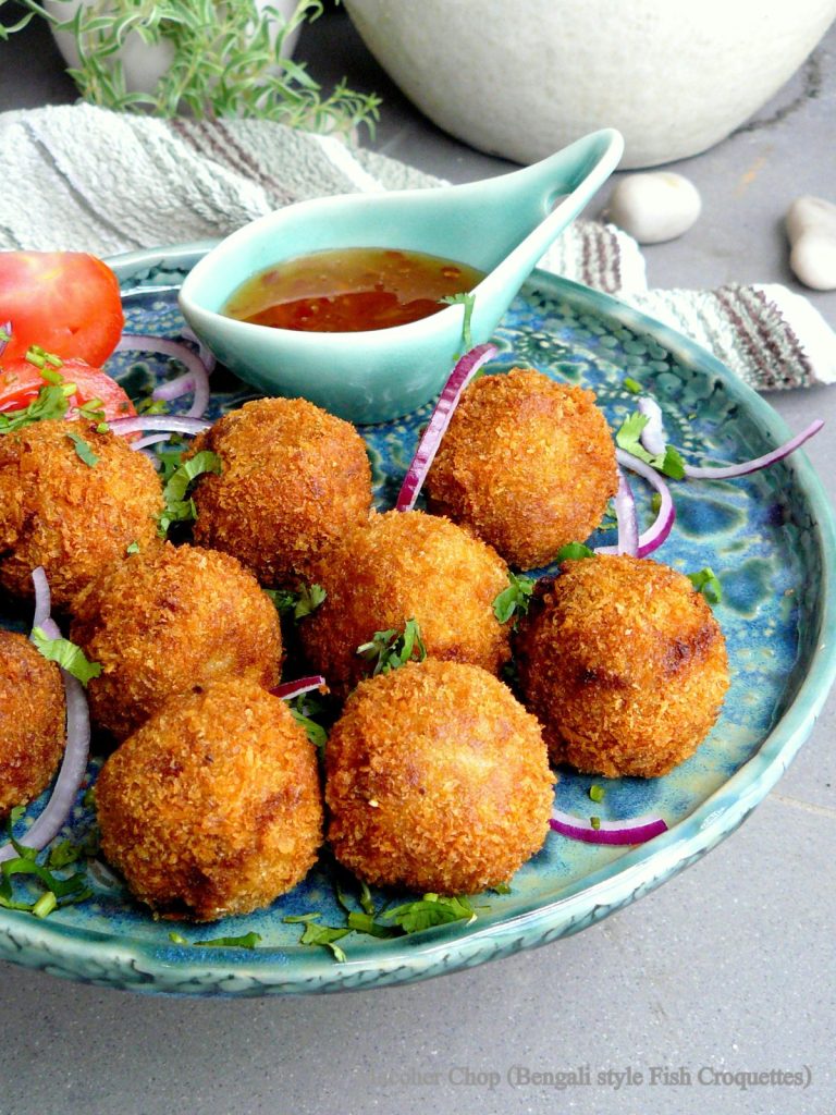 Indian style fish croquettes with dipping sauce on the side