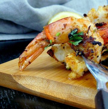 Close up of fried tiger prawn on fork
