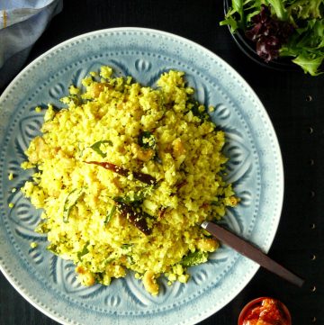 Indian style cauliflower rice served on blue plate