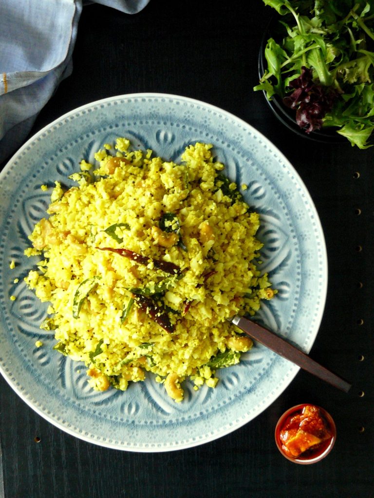 Indian style cauliflower rice served on blue plate