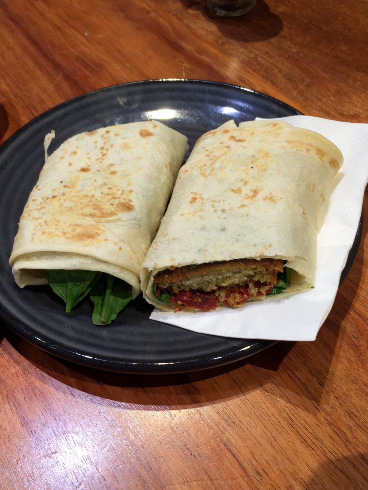 Falafel roti with spinach, hummus, avocado, sundried tomatoes and mint