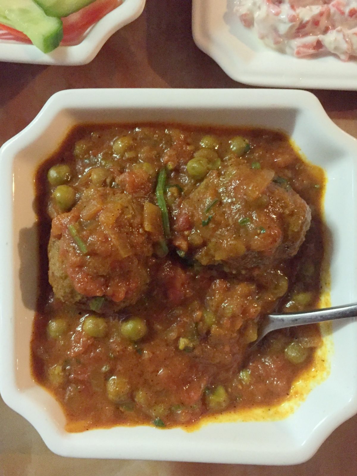 Meatball/Kofta curry (Lamb mince marinated with diced onions and herbs, curried in a delicious tomato and pea gravy)