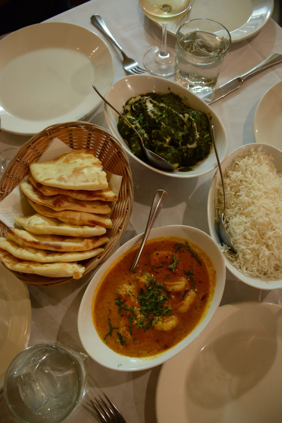 Steamed basmati rice and naan/bread accompanied with Saag Paneer (cottage cheese and spinach curry) and Jheenga Nariyal (King prawns cooked with coconut and spices). 
